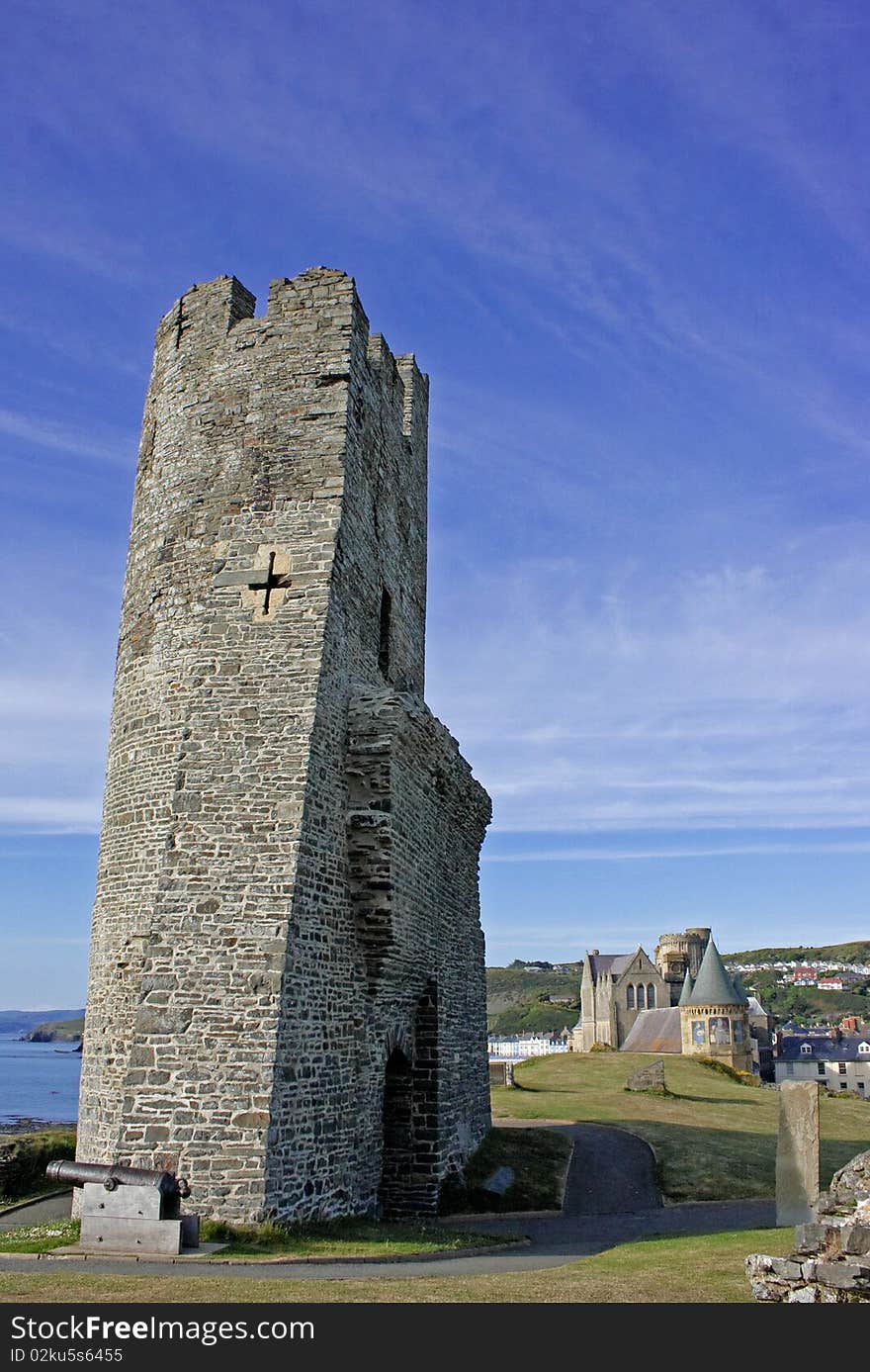 A view of the tower of Aberystwyth castle with the Old College of Aberystwyth University in the background. A view of the tower of Aberystwyth castle with the Old College of Aberystwyth University in the background