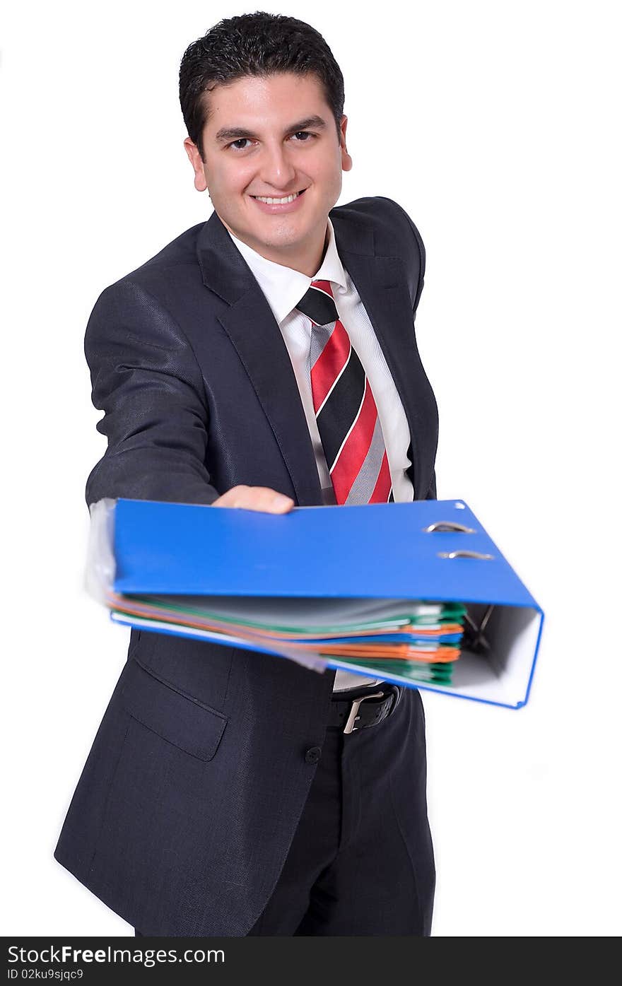 A young businessman giving a binder full of files. A young businessman giving a binder full of files.