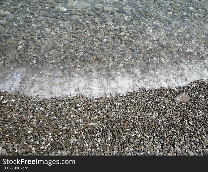 Pebble on the beach in Calabria.
Crystal clear water and gentle foot massage by walking on the fresh gravel. Pebble on the beach in Calabria.
Crystal clear water and gentle foot massage by walking on the fresh gravel.