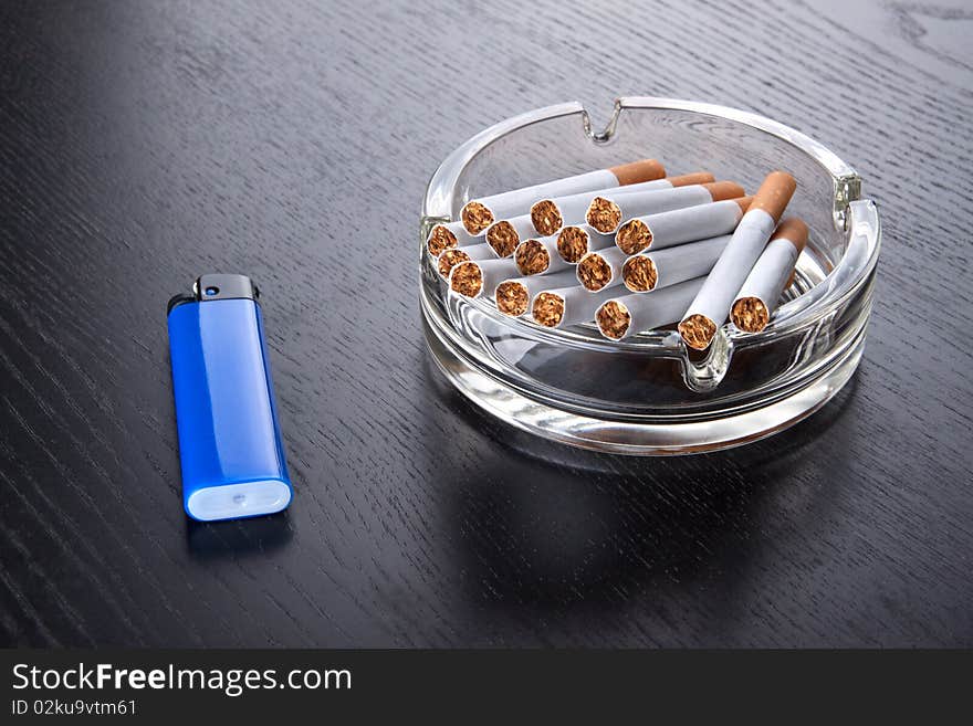 Ashtray and lighter on a table