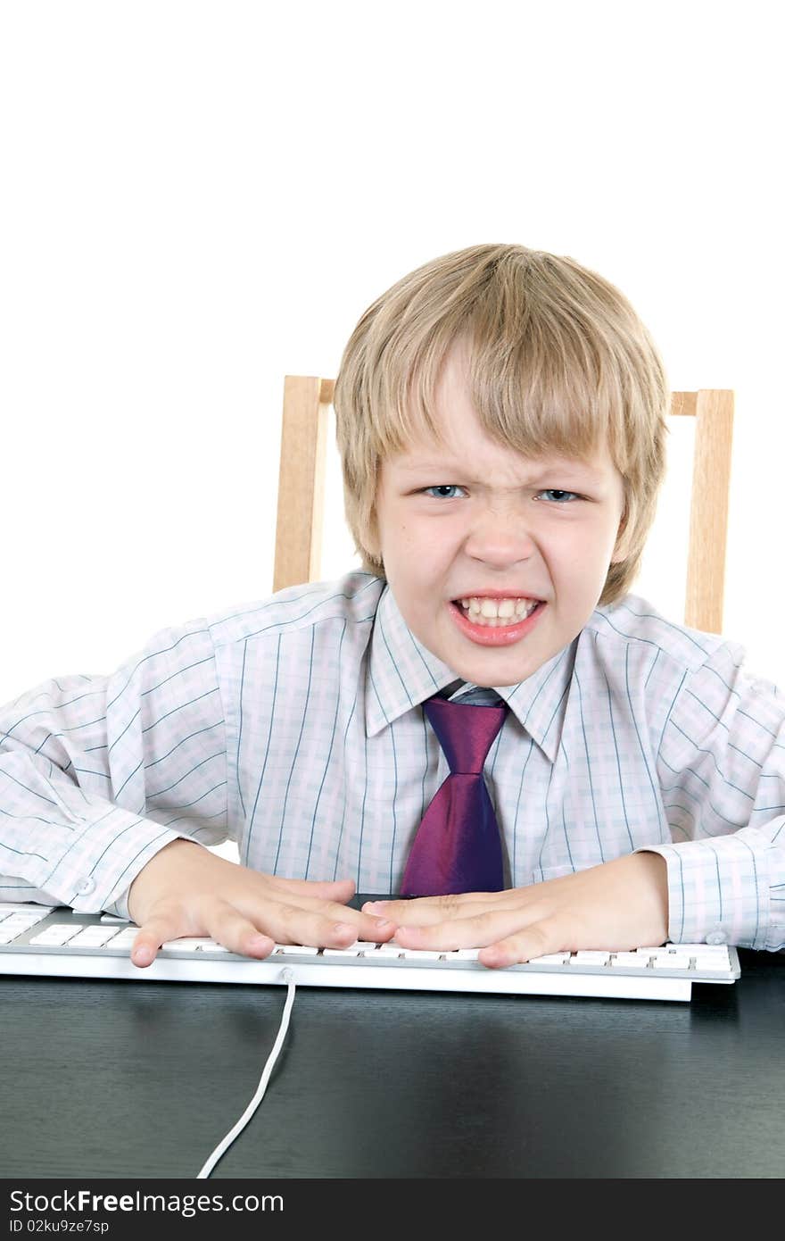 Boy with keyboard isolated on white