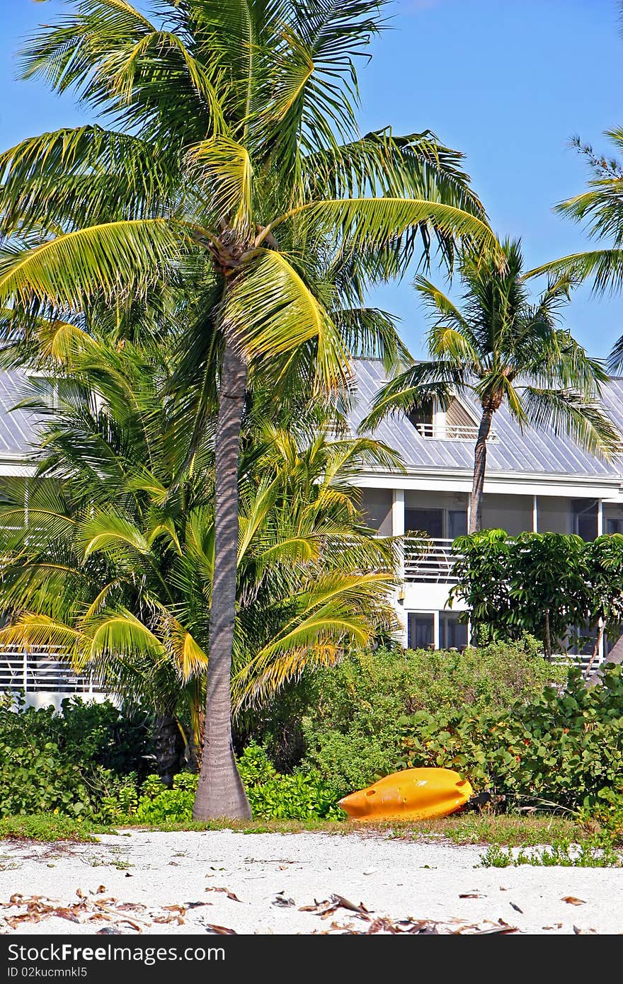 Small yellow boat on beach Sanibel Island Florida