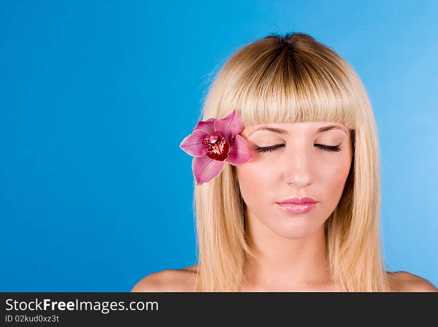 Portrait of beautiful face close-up with flower