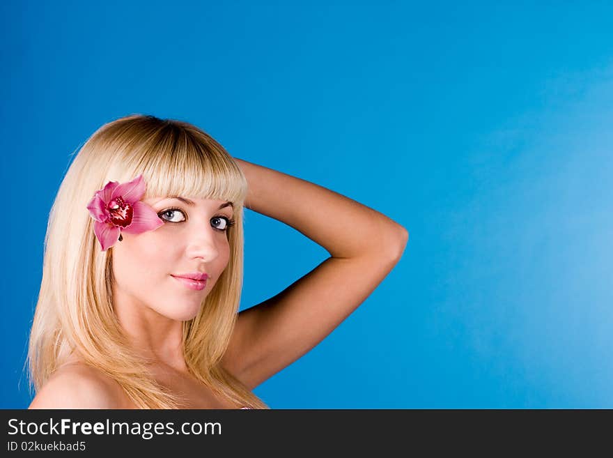 Cute Blonde With An Orchid In Her Hair