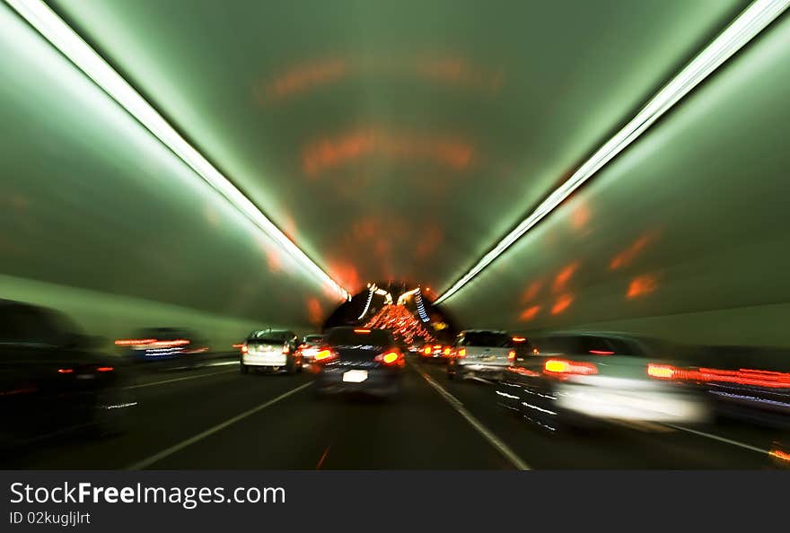 Motion blur inside tunnel on the way out to a bridge. Motion blur inside tunnel on the way out to a bridge