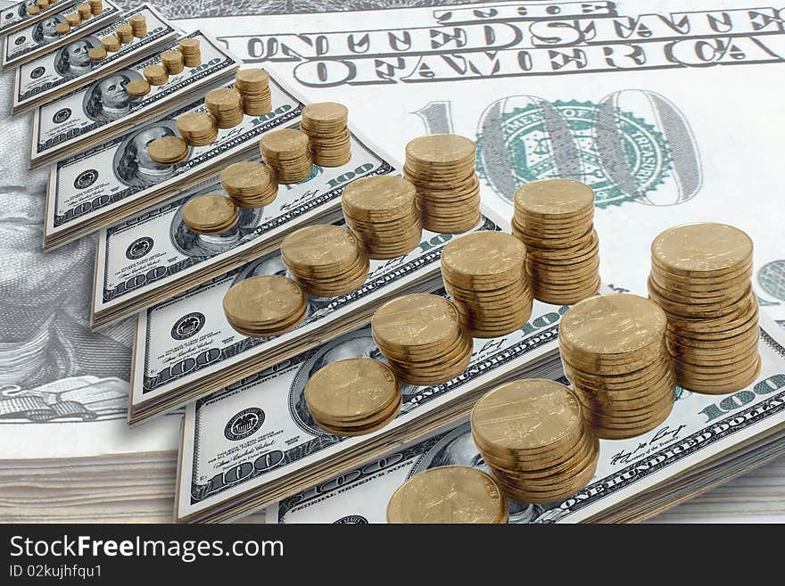 Dollars and coins  located on a white background