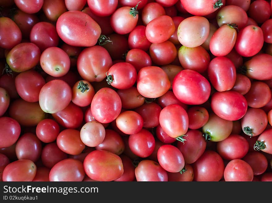 Tomatoes in a container waiting to be delivered.