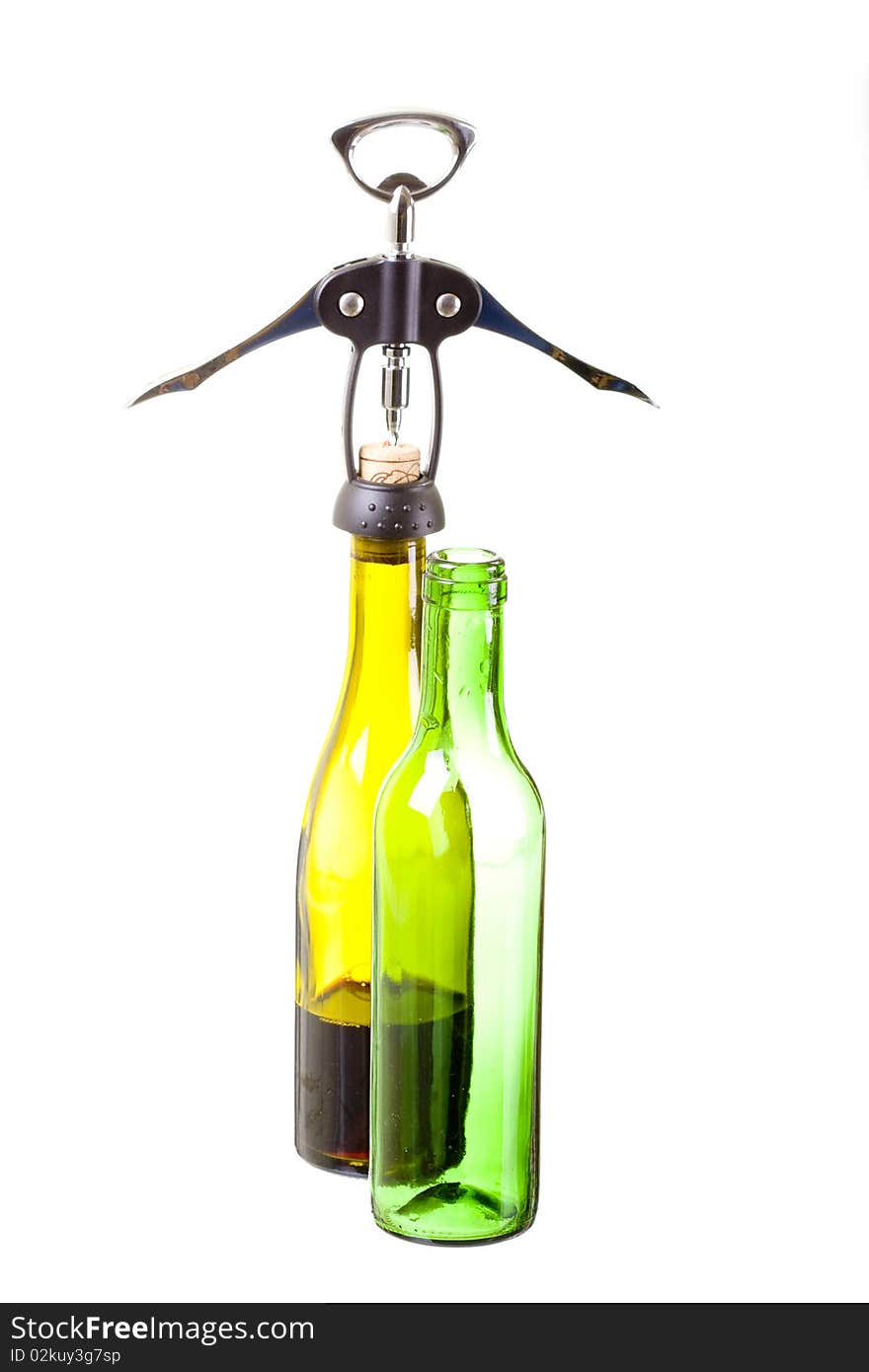 Corkscrew and green wine bottles. Corkscrew and green wine bottles