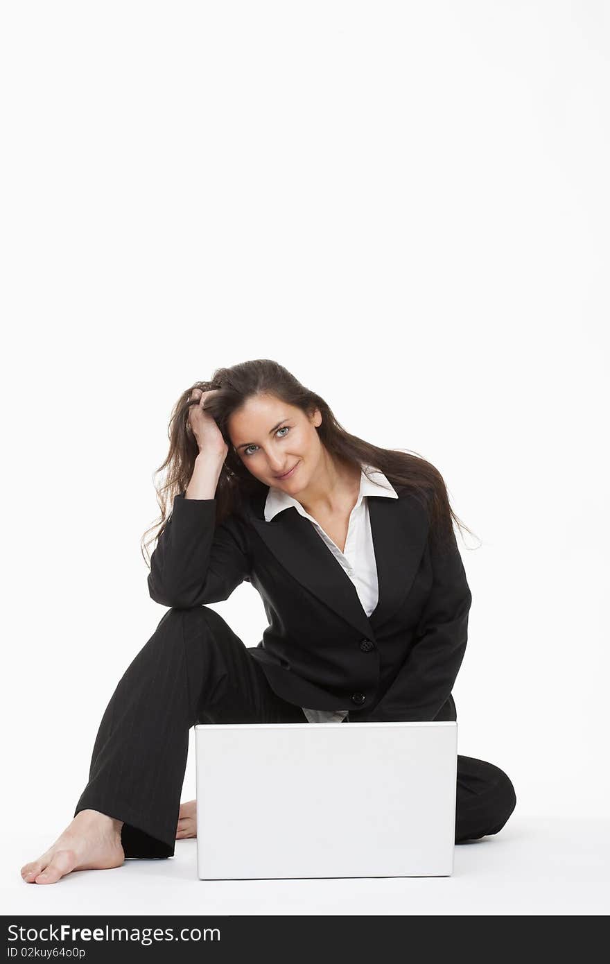 Attractive young businesswoman working with laptop computer smiling. Attractive young businesswoman working with laptop computer smiling