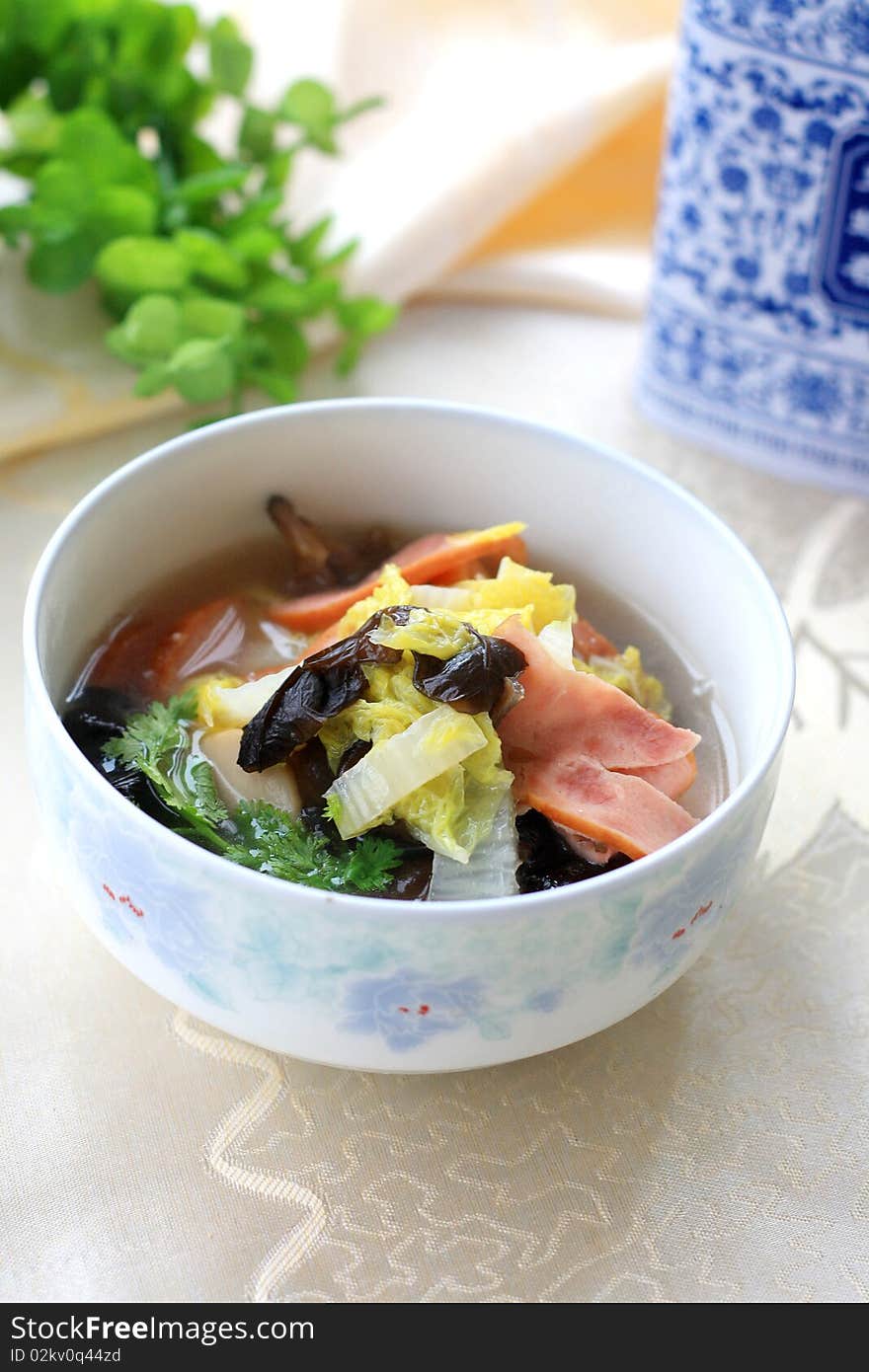 A bowl of soup of vegetables. Focus across the middle of image. A bowl of soup of vegetables. Focus across the middle of image.