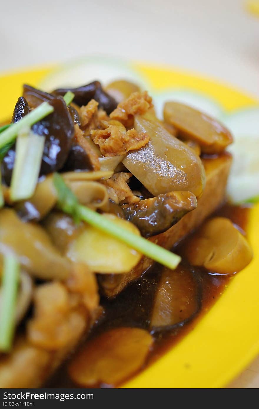 Home cooked Chinese vegetarian bean curd cuisine topped with healthy mushrooms. Suitable for food and beverage, healthy eating and lifestyle, and diet and nutrition. Home cooked Chinese vegetarian bean curd cuisine topped with healthy mushrooms. Suitable for food and beverage, healthy eating and lifestyle, and diet and nutrition.