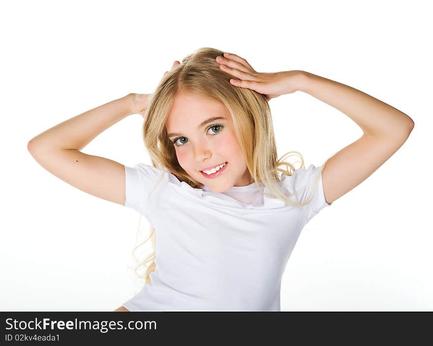 Close-up portrait of a beautiful little girl on white background