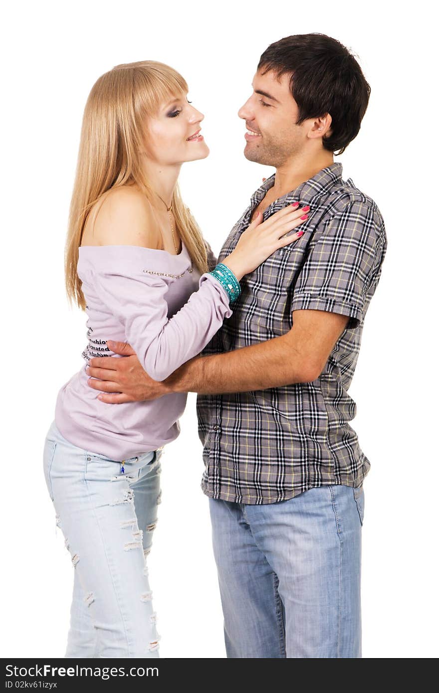 Romantic young couple in casual clothing, white background. Romantic young couple in casual clothing, white background