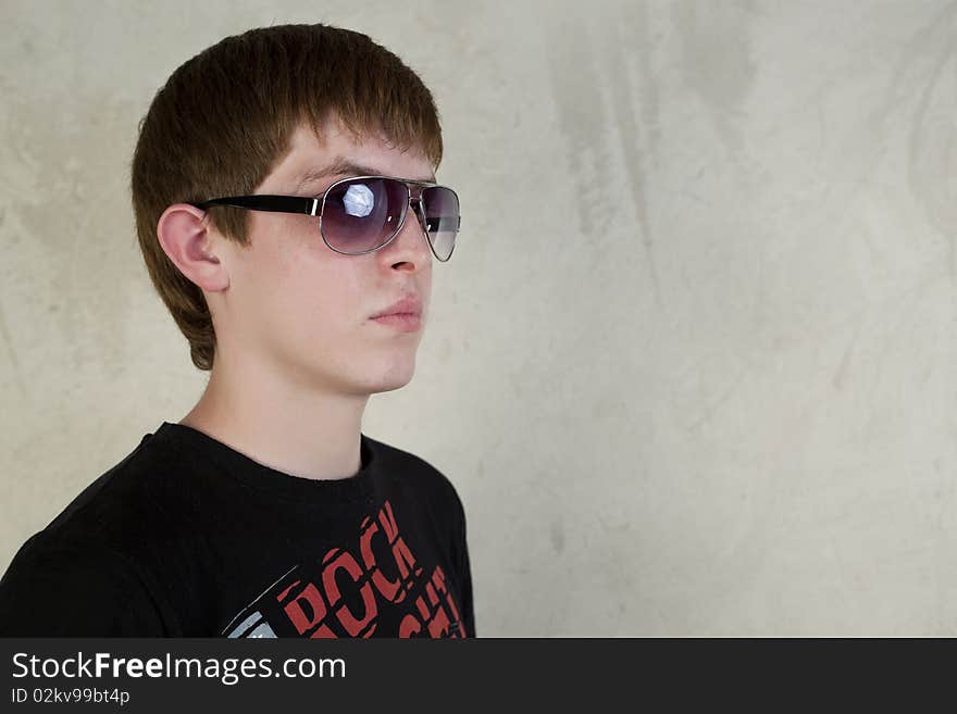 Redhead boy posing on a vintage background. Redhead boy posing on a vintage background