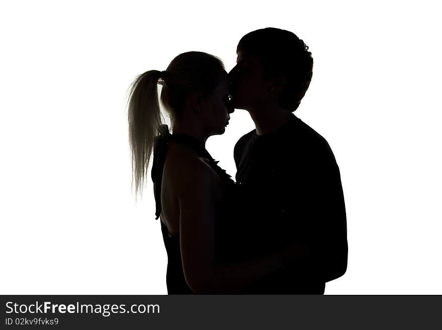 Young man kissing his girlfriend. Young man kissing his girlfriend