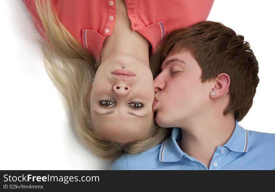 Portrait of a boy kissing his girlfriend. Portrait of a boy kissing his girlfriend