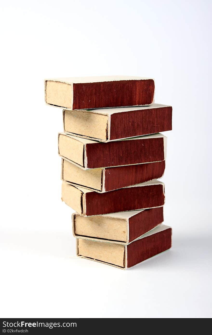 Stack of seven matchboxes on white background. Stack of seven matchboxes on white background