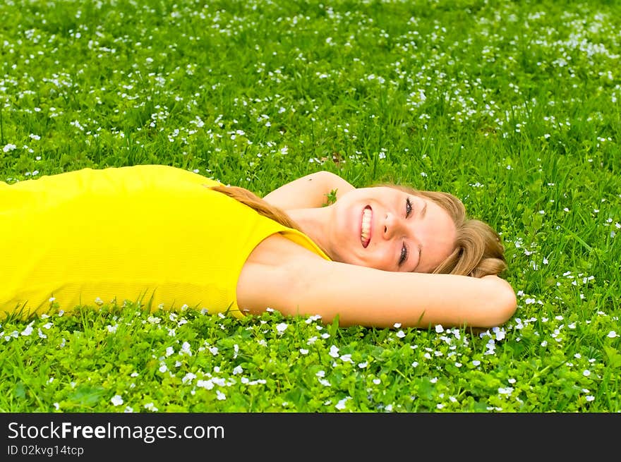 Portrait of young smiling woman on meadow. Portrait of young smiling woman on meadow