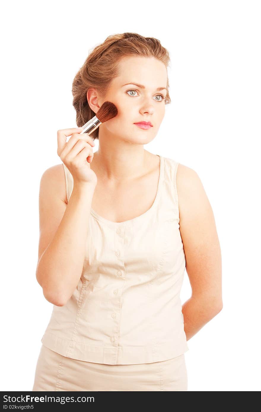 Girl with powder brush isolated on white