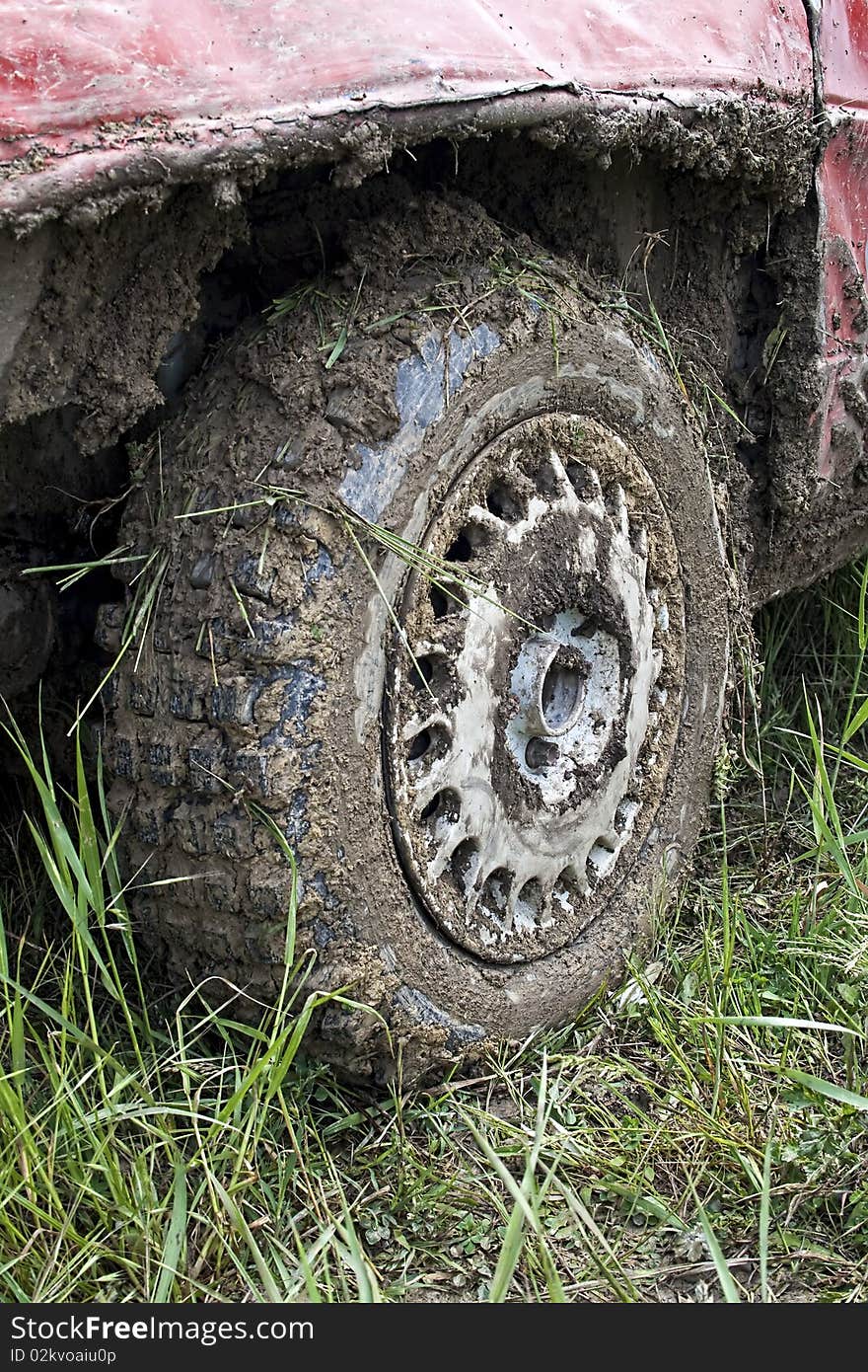 Muddy car tire from car race