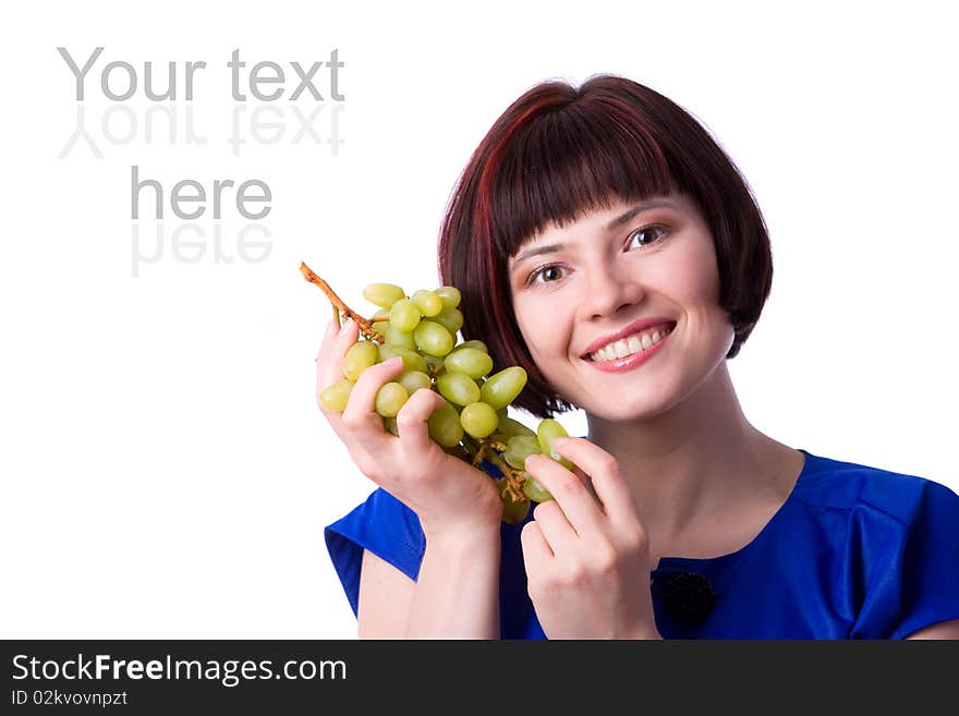 Woman holding a bunch of green grapes