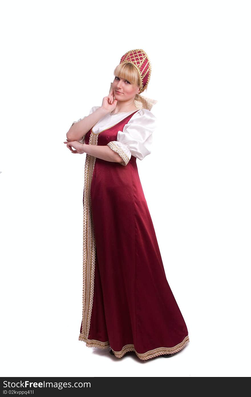 Girl standing in Russian traditional costume. Woman is wearing sarafan and kokoshnik . The girl in red old russian dress. Isolated on white. Girl standing in Russian traditional costume. Woman is wearing sarafan and kokoshnik . The girl in red old russian dress. Isolated on white.