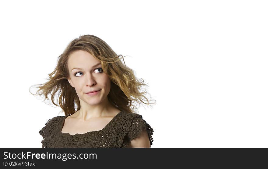 Head and shoulder portrait of smiling girl with blond hair looking upwards-right, isolated on white background. Head and shoulder portrait of smiling girl with blond hair looking upwards-right, isolated on white background.