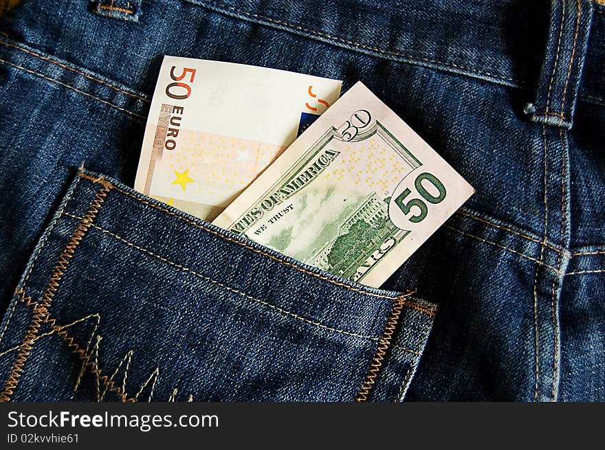 Euro And Dollar Banknotes In Jeans Pocket