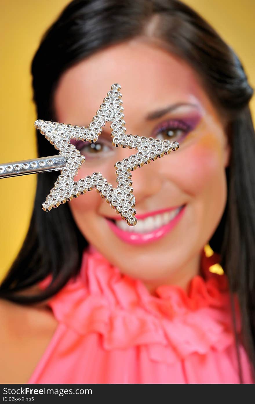 Beautiful woman with creative make-up and the star making a wish. focus on star