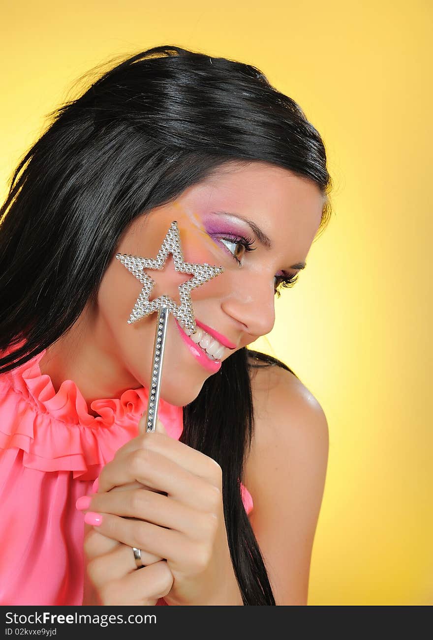 Beautiful woman with creative make-up and the star making a wish. focus on star