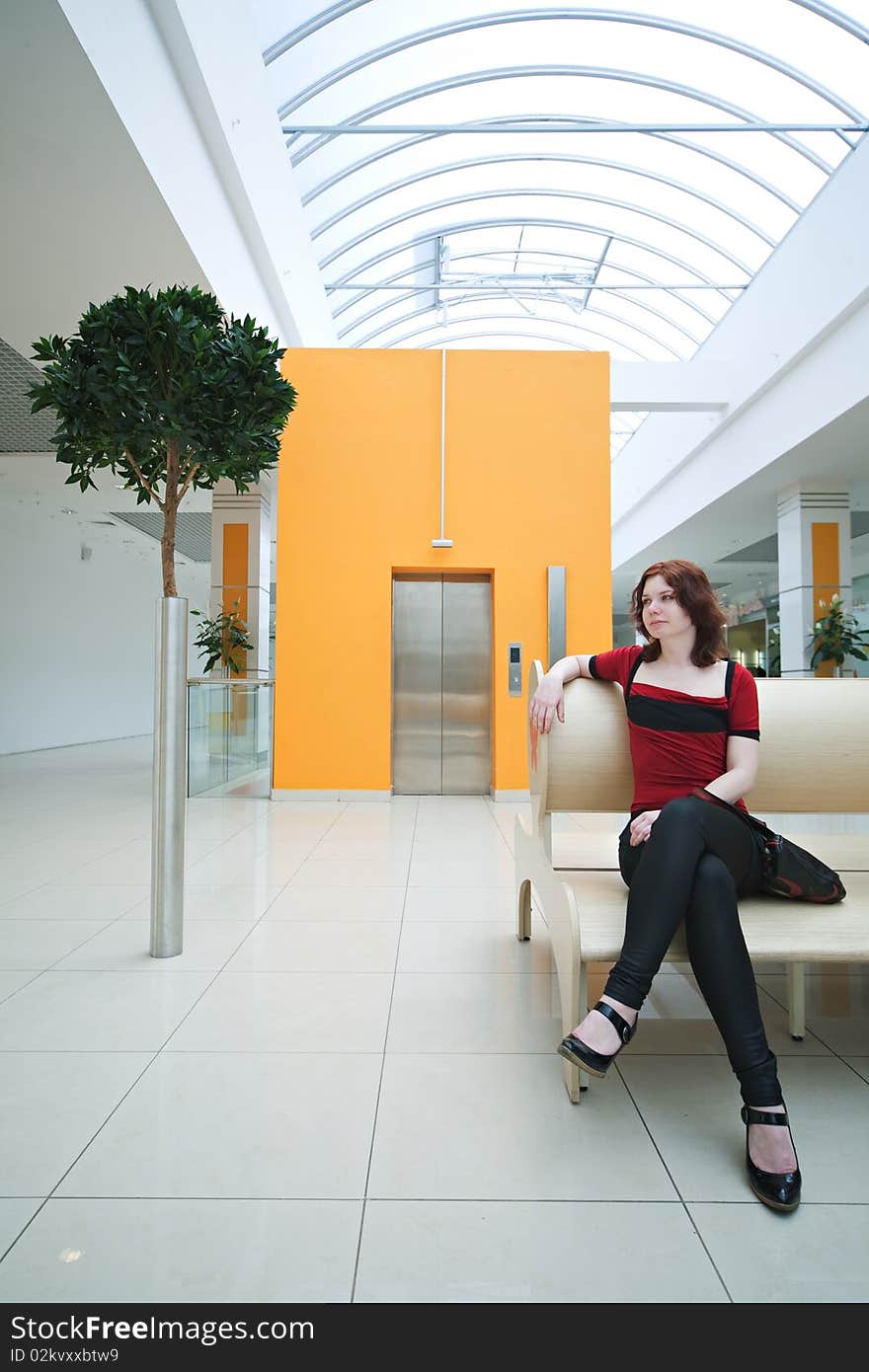 Woman in  shopping mall with lift