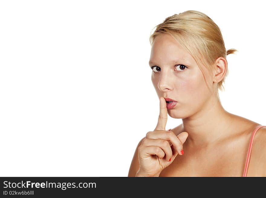 Portrait of an attractive young blonde girl hushing. Isolated over white. Portrait of an attractive young blonde girl hushing. Isolated over white.