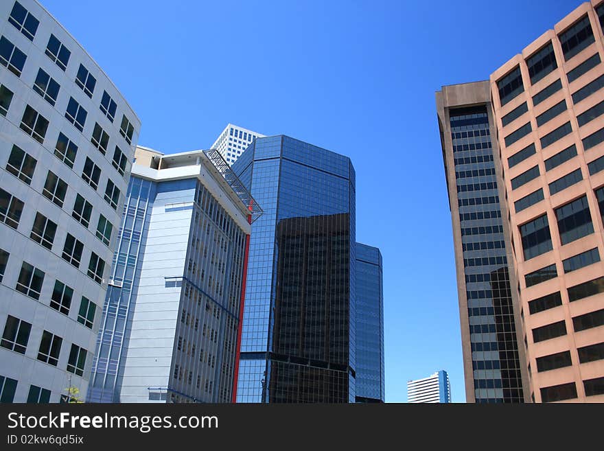 Downtown city building meet the sky in a colorful blend of textures. Downtown city building meet the sky in a colorful blend of textures.