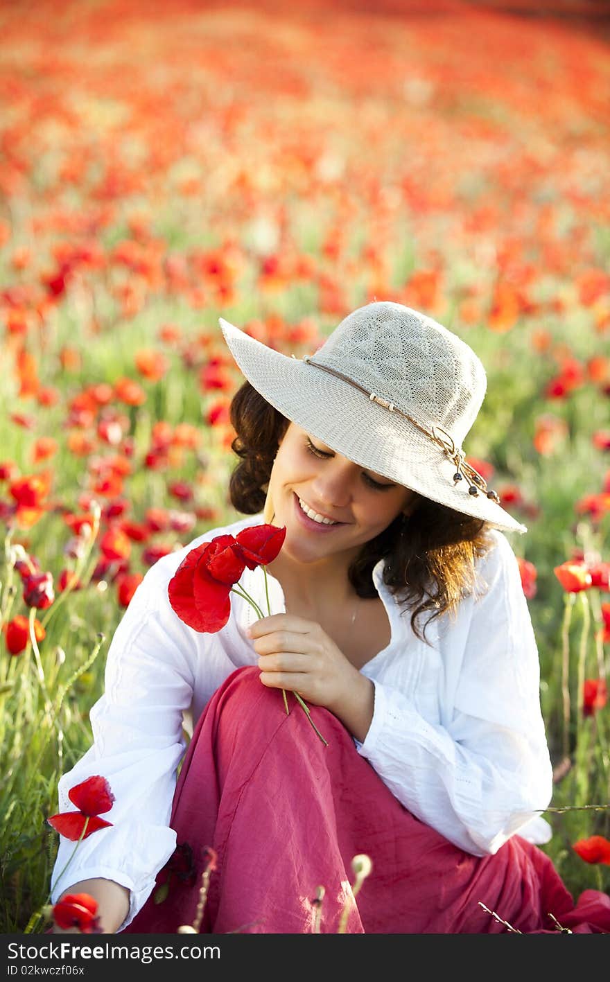 Young beautiful woman in spring field. Young beautiful woman in spring field