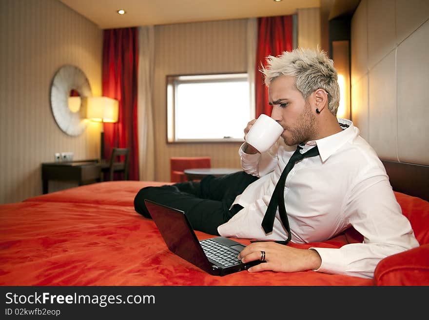 Smiling man in headphones in work place