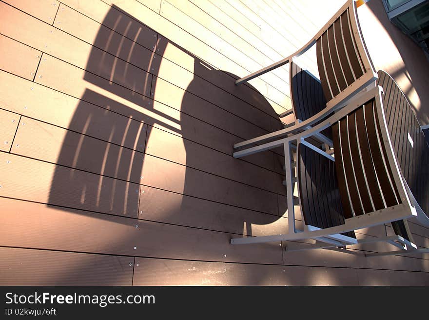 Lounge chairs at sunset on a resorts  deck .