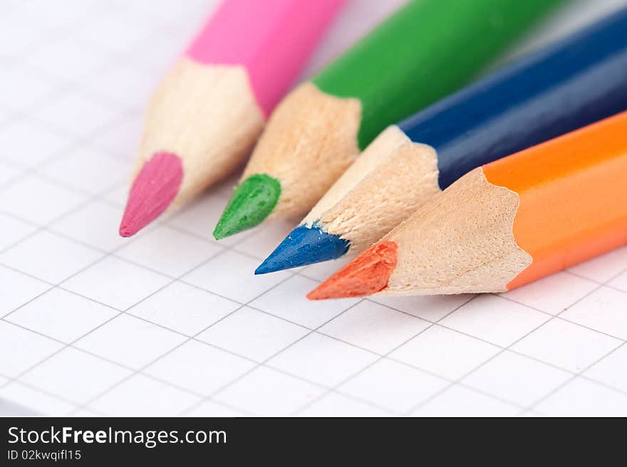 Four colorful pencils close up