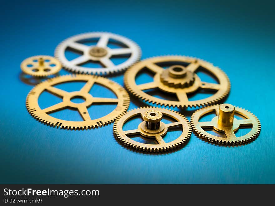 Close up of old clock gears with limited depth of field