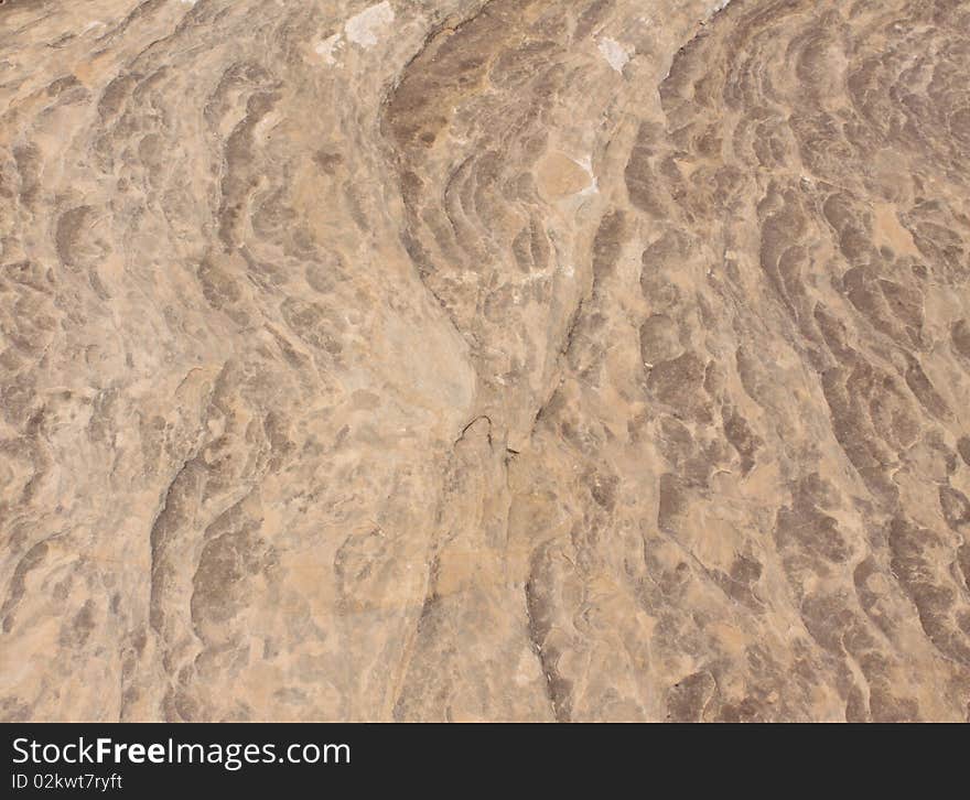 Textered red rock background pattern from the desert of Utah. Textered red rock background pattern from the desert of Utah.