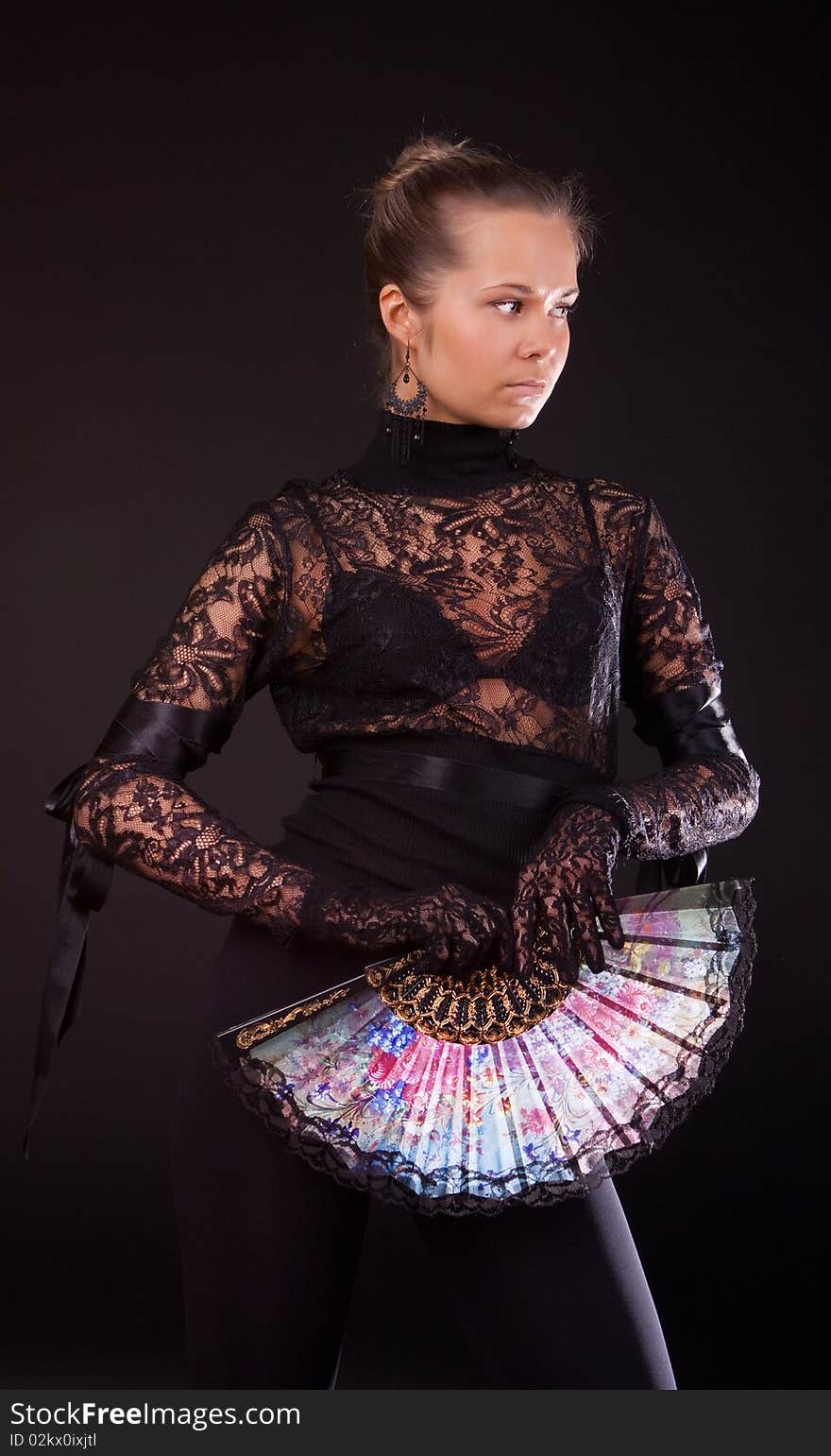 Studio shot of girl with fantail. Studio shot of girl with fantail