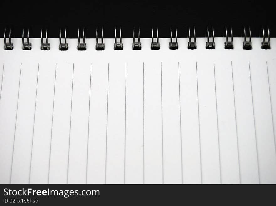 Closeup opened  notebook with the line and white background. Closeup opened  notebook with the line and white background