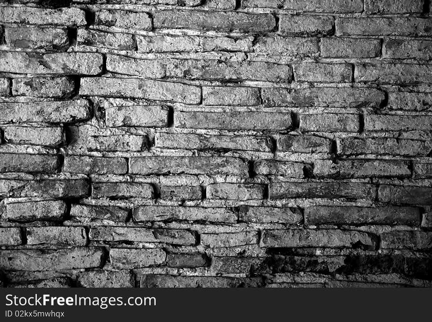 Grunge bricks wall with dramatic lighting. Grunge bricks wall with dramatic lighting