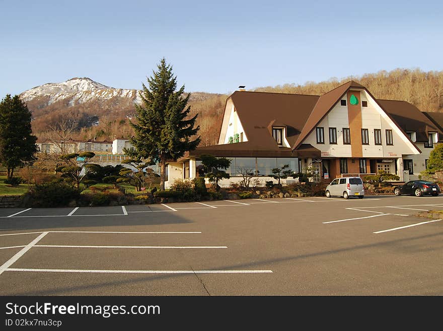 Modern House at the foot of snow capped mountain. Modern House at the foot of snow capped mountain