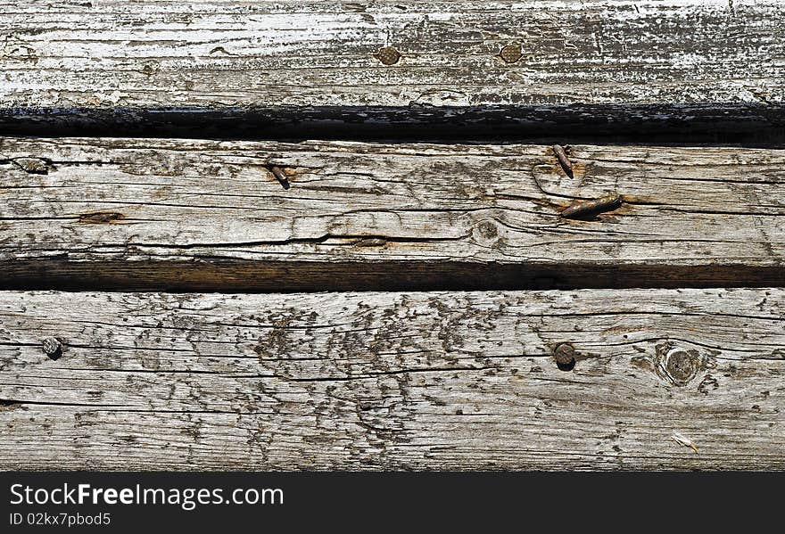 Small part of wooden fence. Old planking. Small part of wooden fence. Old planking