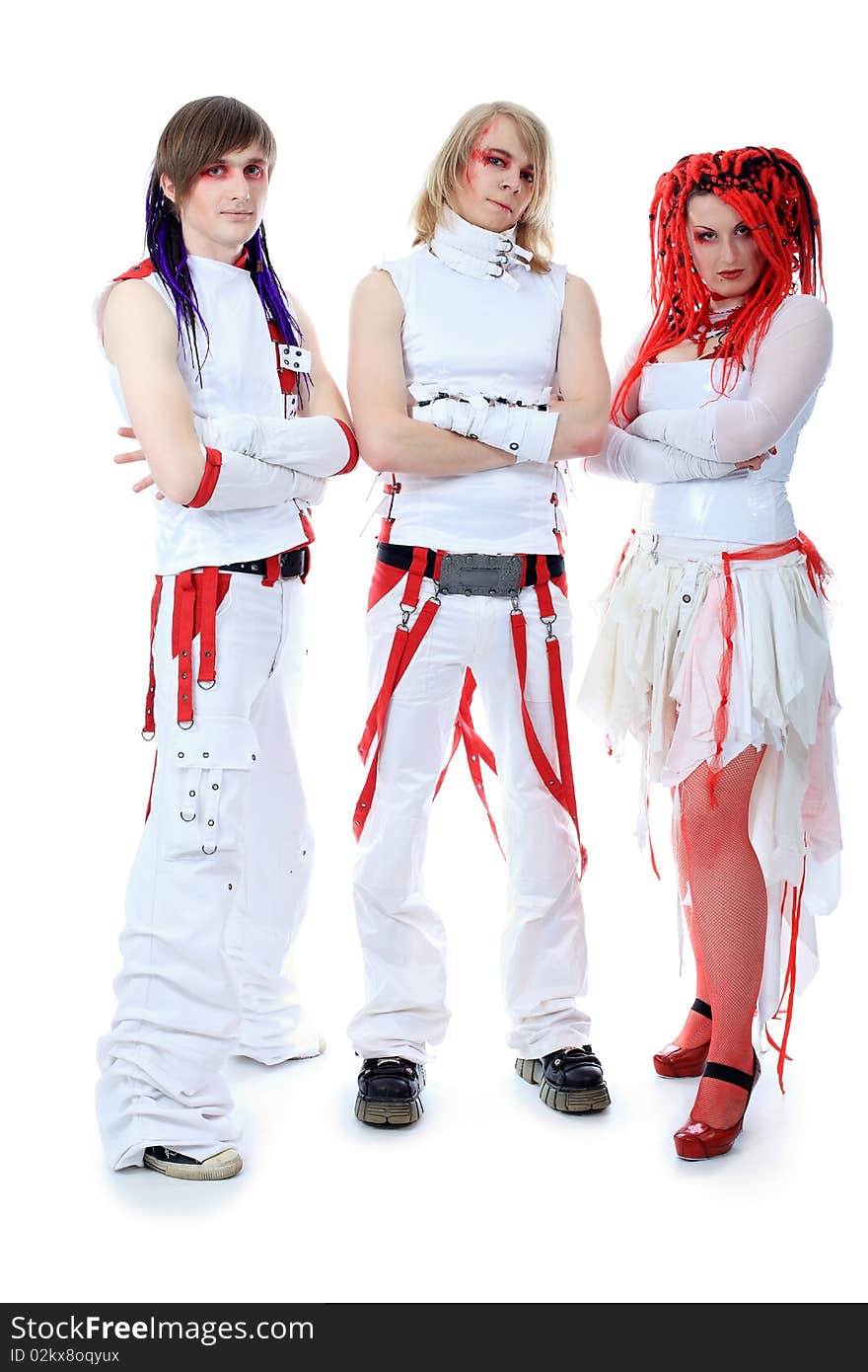 Rock group is posing together. Shot in a studio. Rock group is posing together. Shot in a studio.