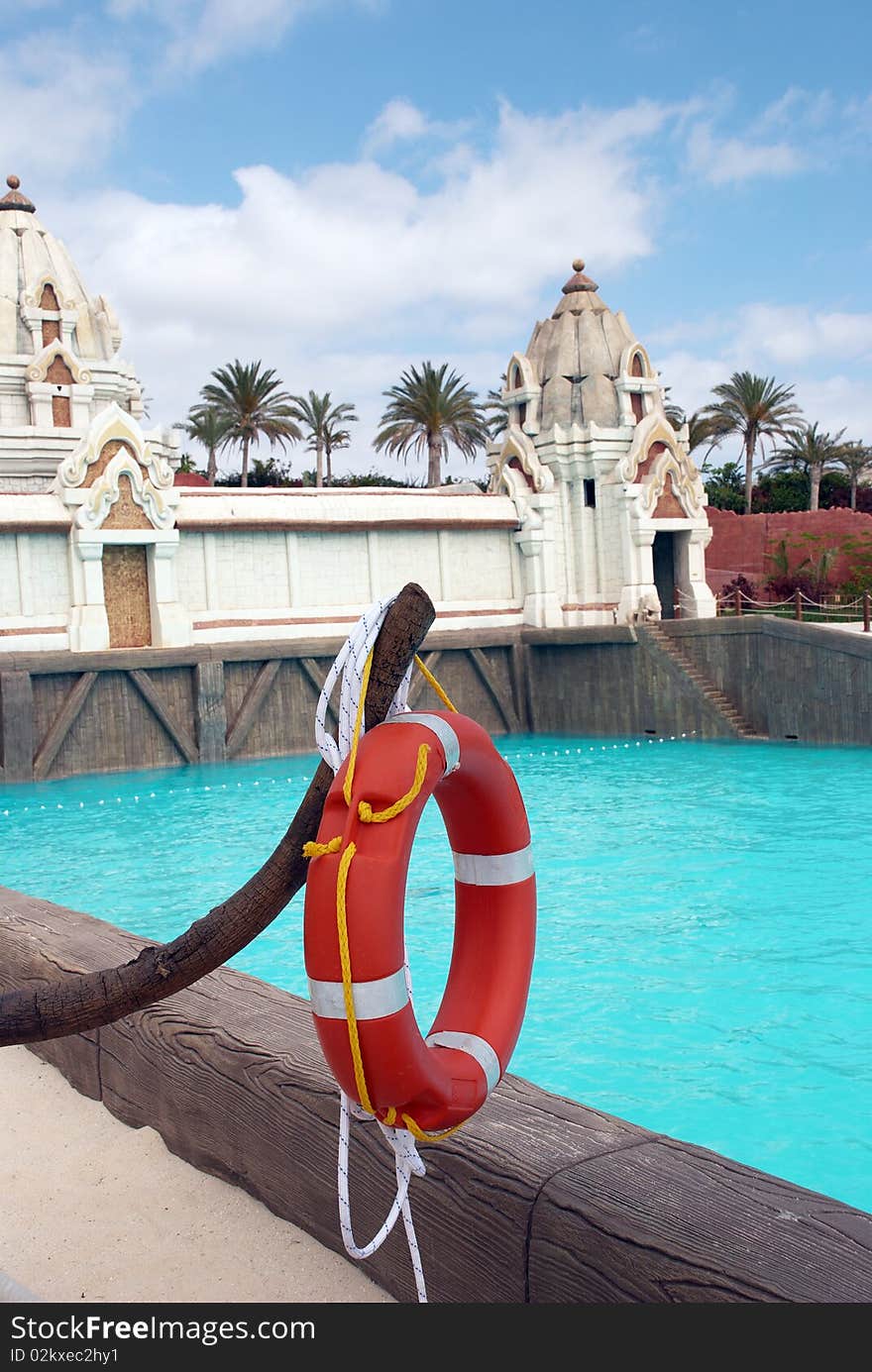 Life buoy on the background of swimming pool in the water park