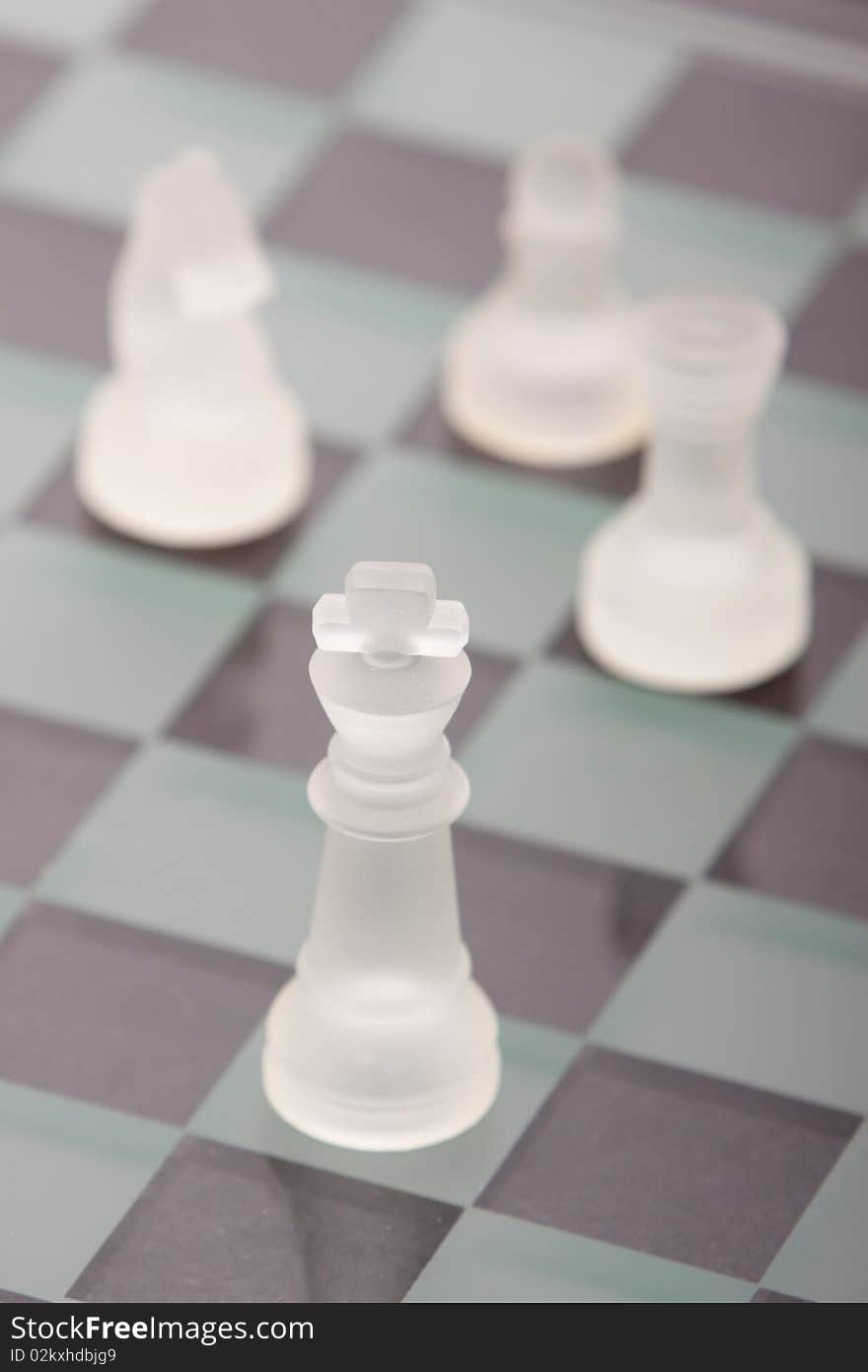 A game of chess with glass chess set. A game of chess with glass chess set