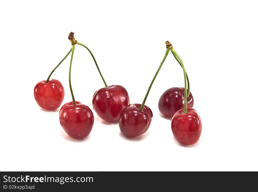 Red cherries on a white background. Red cherries on a white background