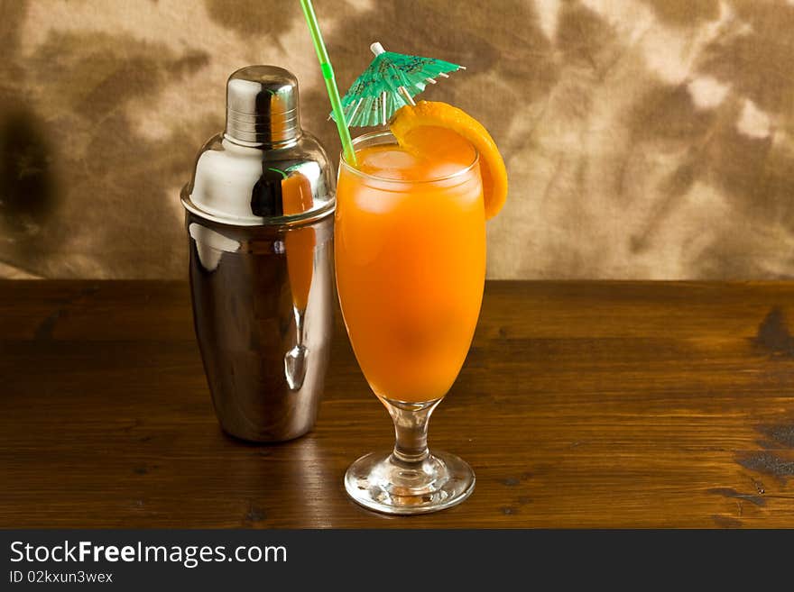 Photo of Orange cocktail on wood table