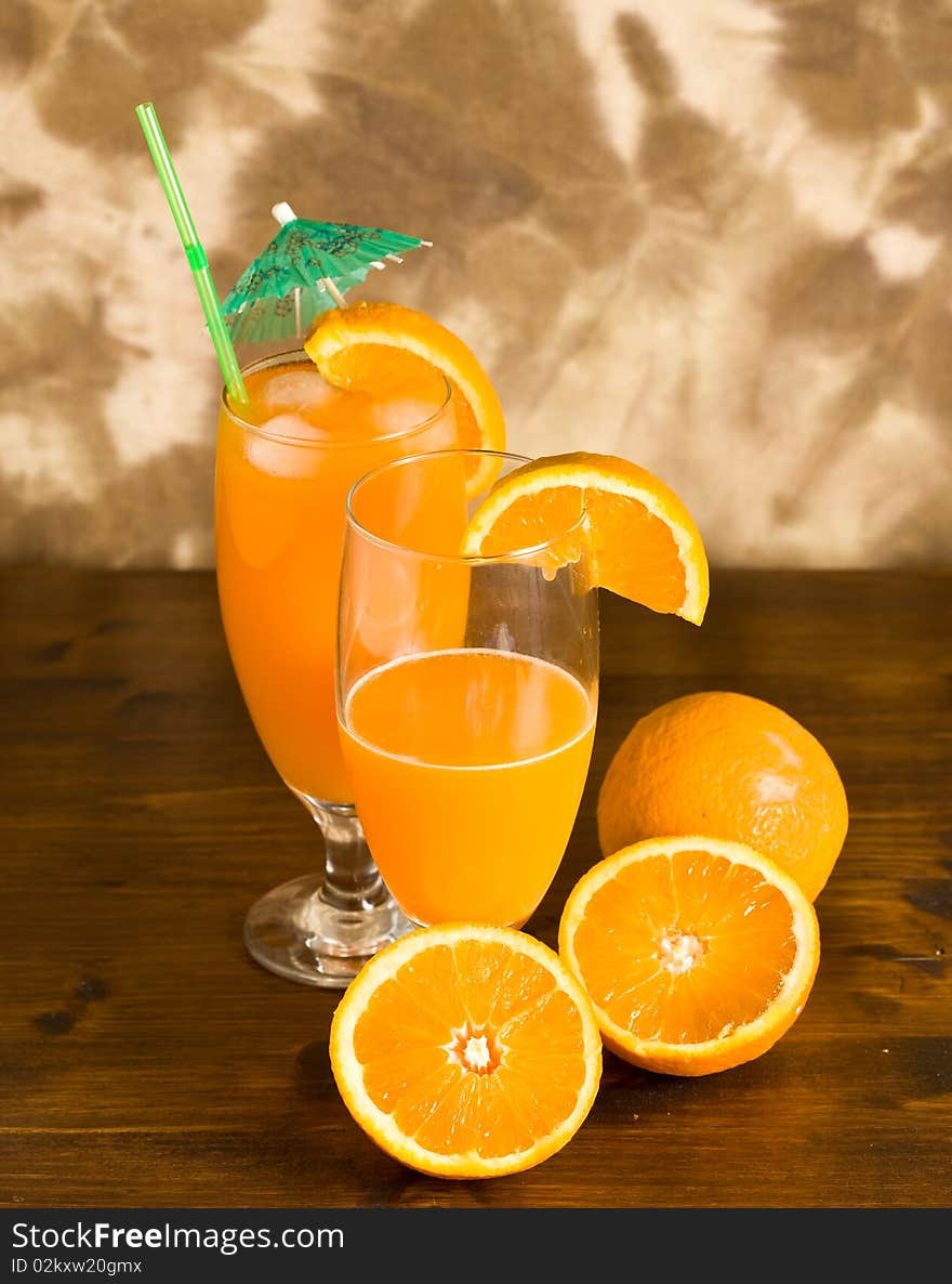 Photo of Orange cocktail on wood table